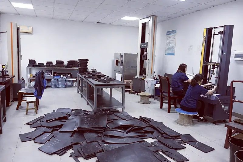 Rubber conveyor belt testing laboratory with tensile strength testing machines and fabric belt samples
