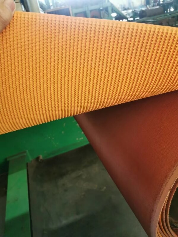 Orange rough top conveyor belt textured anti-slip surface with fabric back