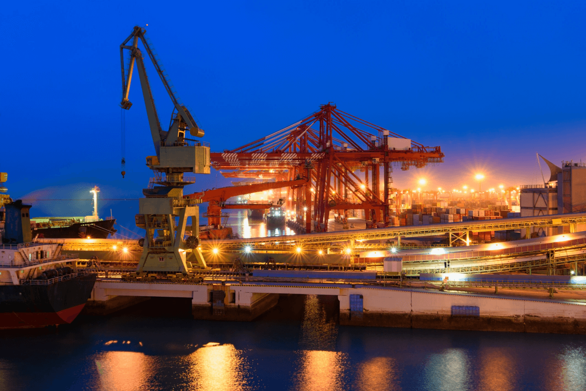 Pipe conveyor belt system operating at large international port terminal for bulk material handling at night