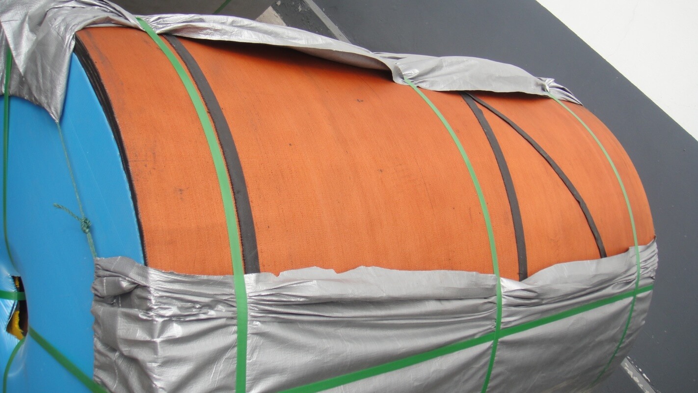 Rough top conveyor belt bare back type rolled and packed for shipment