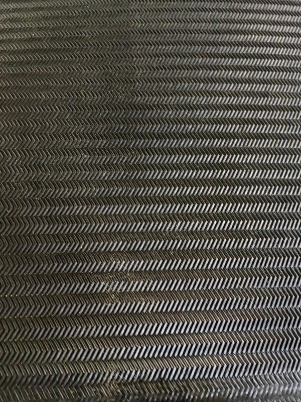 Solid Woven PVC PVG conveyor belt surface texture close-up, anti-slip woven pattern for underground coal mining conveyor systems